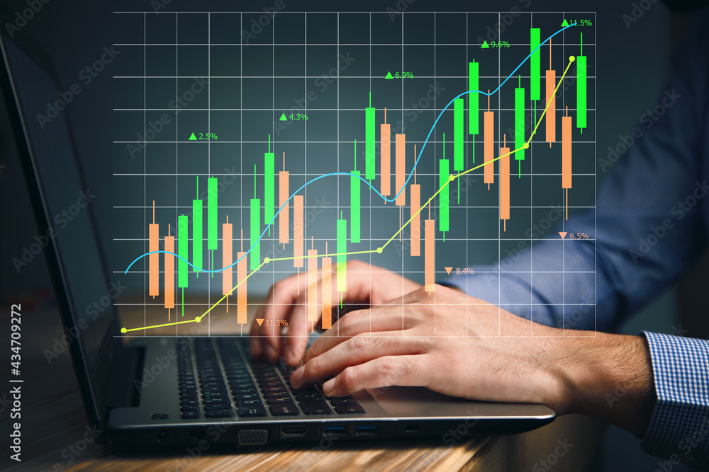Hands typing the keyboard to research stock market Hands typing the keyboard to research stock market