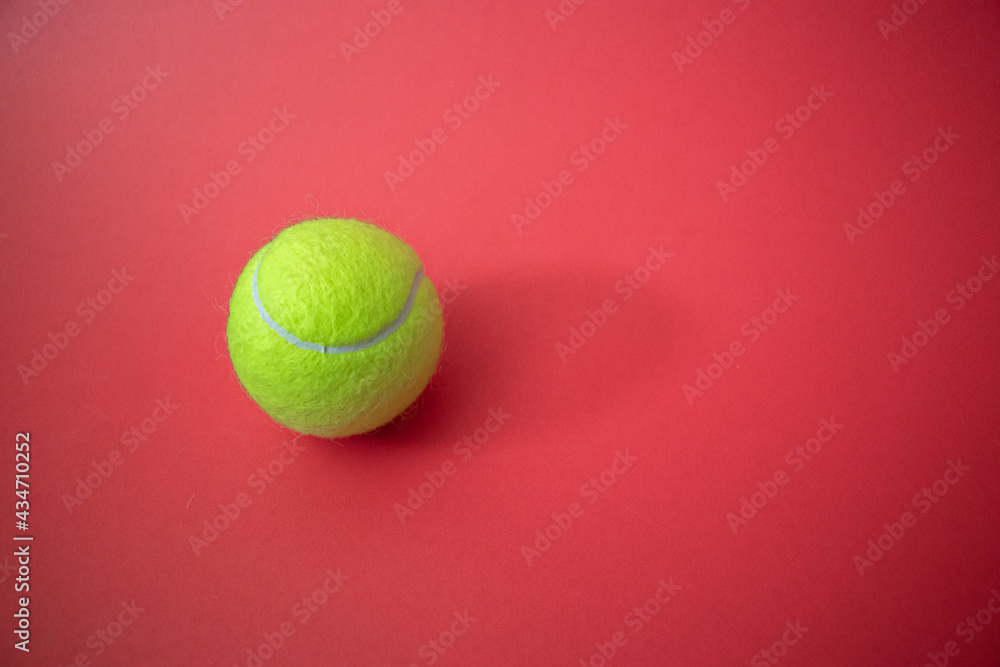 tennis ball on the court red background