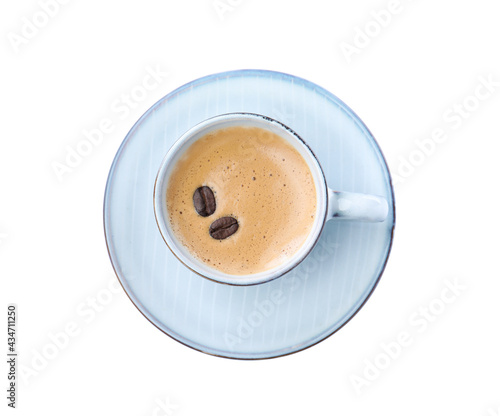 Cup of aromatic coffee with beans isolated on white, top view