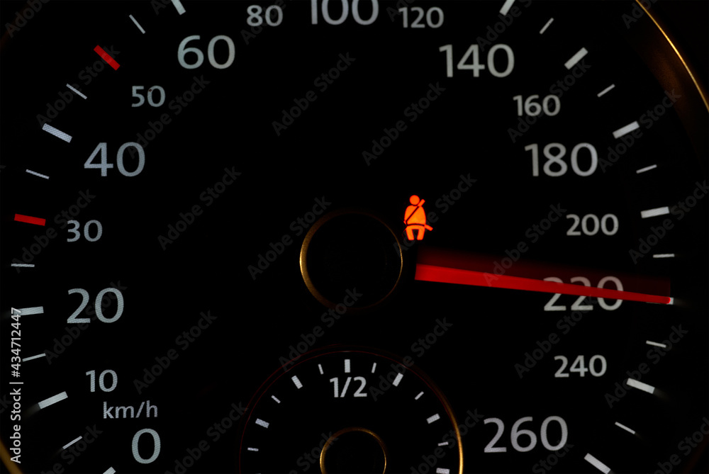 Dashboard of car - speedometer showing 220 km per hour Dashboard of car - speedometer showing 220 km per hour