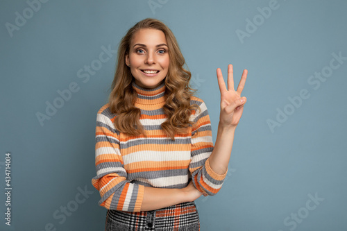 Obraz na plátně Photo of young positive happy smiling beautiful woman with sincere emotions wear