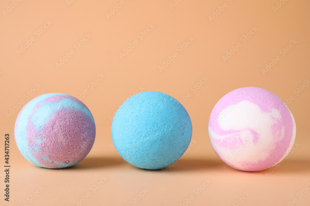 Different colorful bath bombs on beige background Different colorful bath bombs on beige background