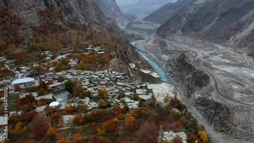 Aerial circling above ancient Altit fort, Hunza Valley in autumn colors photo