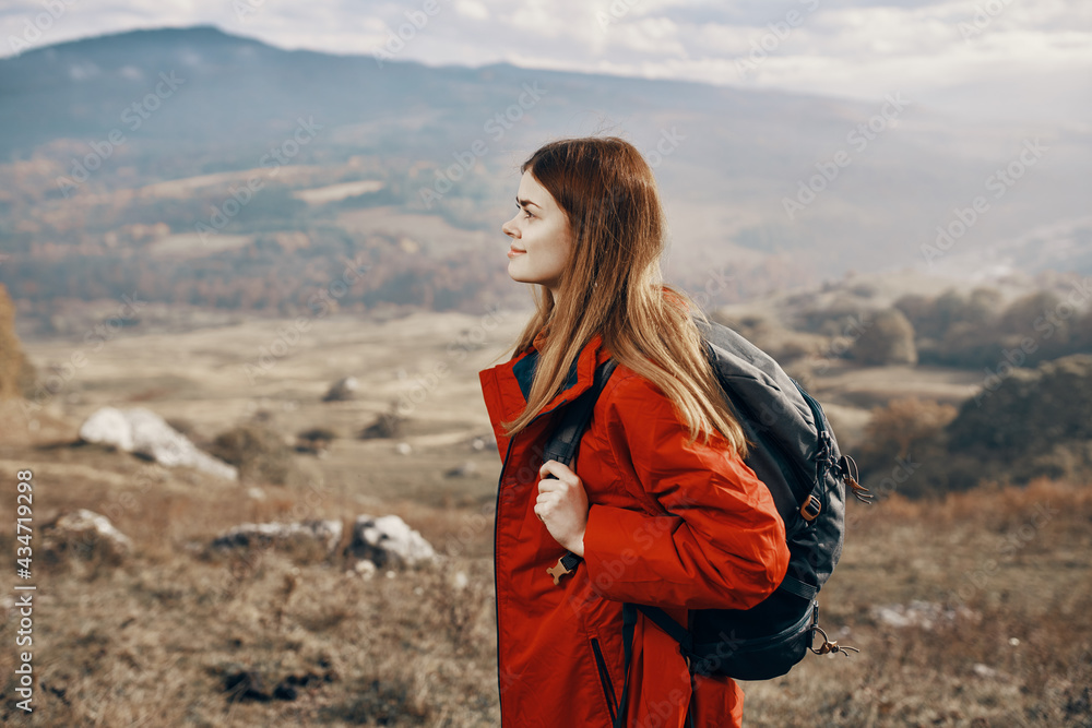 Travel woman with backpack rest in the mountains on nature landscape tourism