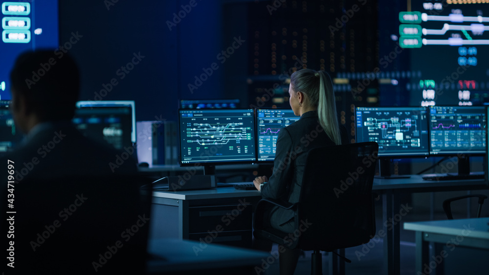Computer Science Female Engineer Working under Important Project on Personal Computer Showing Infrastructure Infographics and Data.Telecommunications Control Monitoring Room with People Working. Computer Science Female Engineer Working under Important Project on Personal Computer Showing Infrastructure Infographics and Data.Telecommunications Control Monitoring Room with People Working.