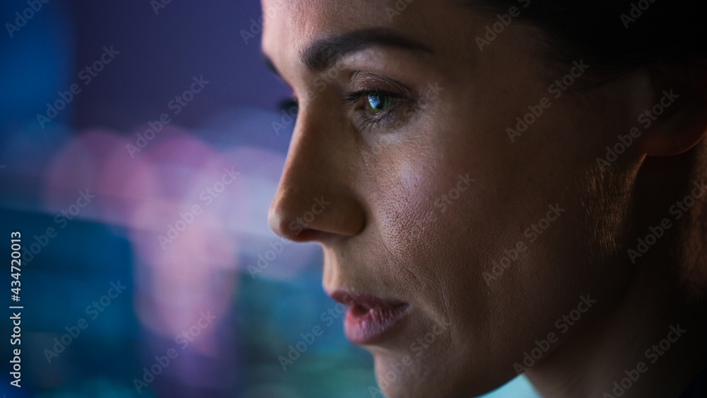 Confident Beautiful Mature Woman Looks at Monitor Screens Focused. Professional Businesswoman Thinking Hard While Working on Computer in the Office. Closeup Face Portrait Confident Beautiful Mature Woman Looks at Monitor Screens Focused. Professional Businesswoman Thinking Hard While Working on Computer in the Office. Closeup Face Portrait