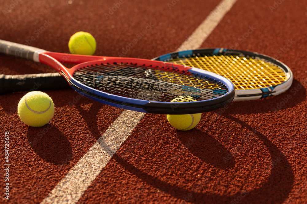 Tennis game. Tennis ball with racket on the tennis court. Sport, recreation concept.