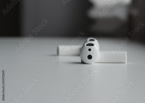 white wireless earphones on the table