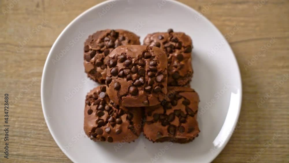 dark chocolate brownies with chocolate chips on top dark chocolate brownies with chocolate chips on top