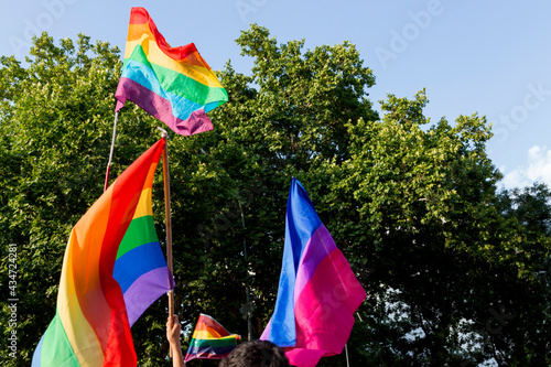 Traditional gay pride flags and a bisexual pride flag