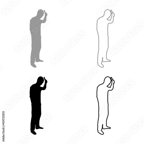 Man is combing hair use hairbrush Side view silhouette grey black color vector illustration solid outline style image