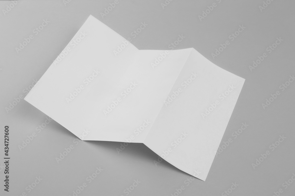 Blank paper brochure on light grey background. Mockup for design Blank paper brochure on light grey background. Mockup for design