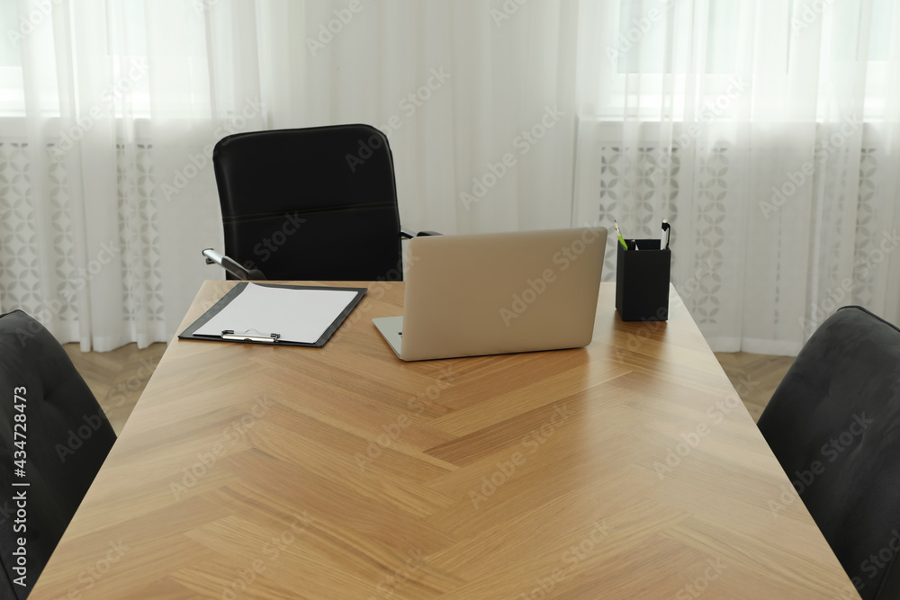 Director's office with large wooden table and comfortable armchairs. Interior design Director's office with large wooden table and comfortable armchairs. Interior design