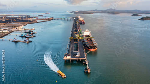RG Tanna coal ship and wharf with coal piles in the background