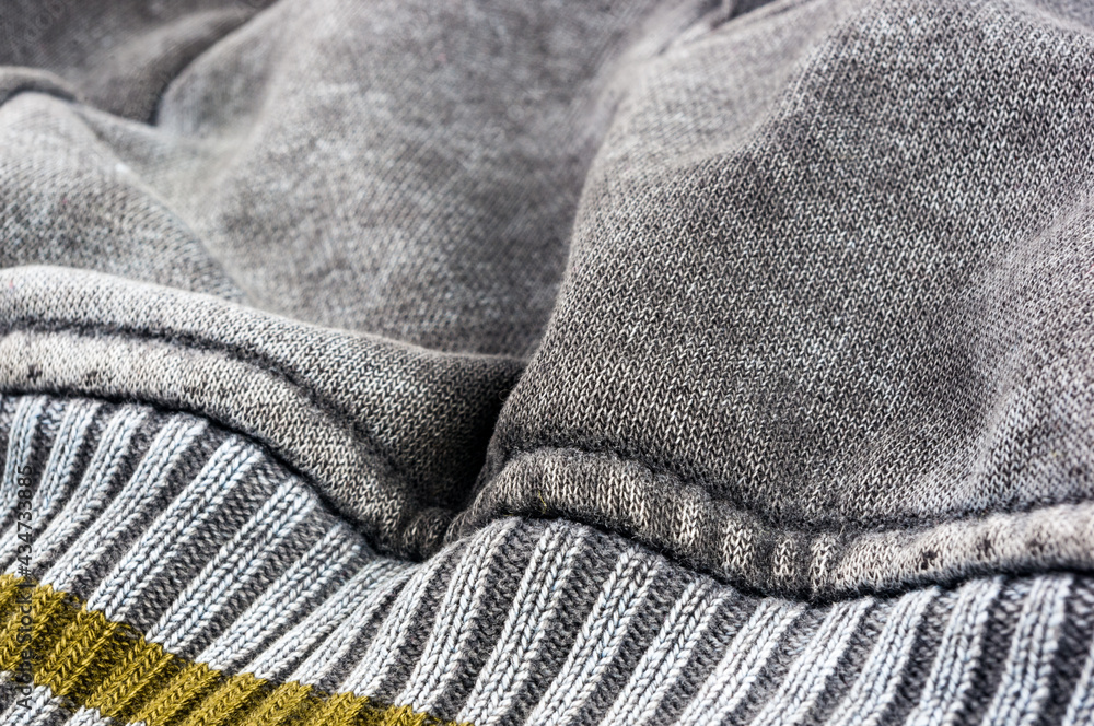clothing items stonewashed cotton fabric texture with seams, clasps, buttons and rivets, macro clothing items stonewashed cotton fabric texture with seams, clasps, buttons and rivets, macro