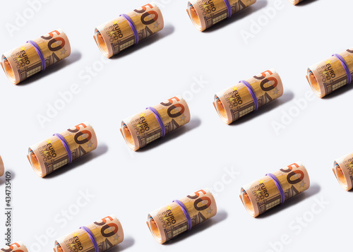 Euro 50 value banknotes roll pattern on gray background