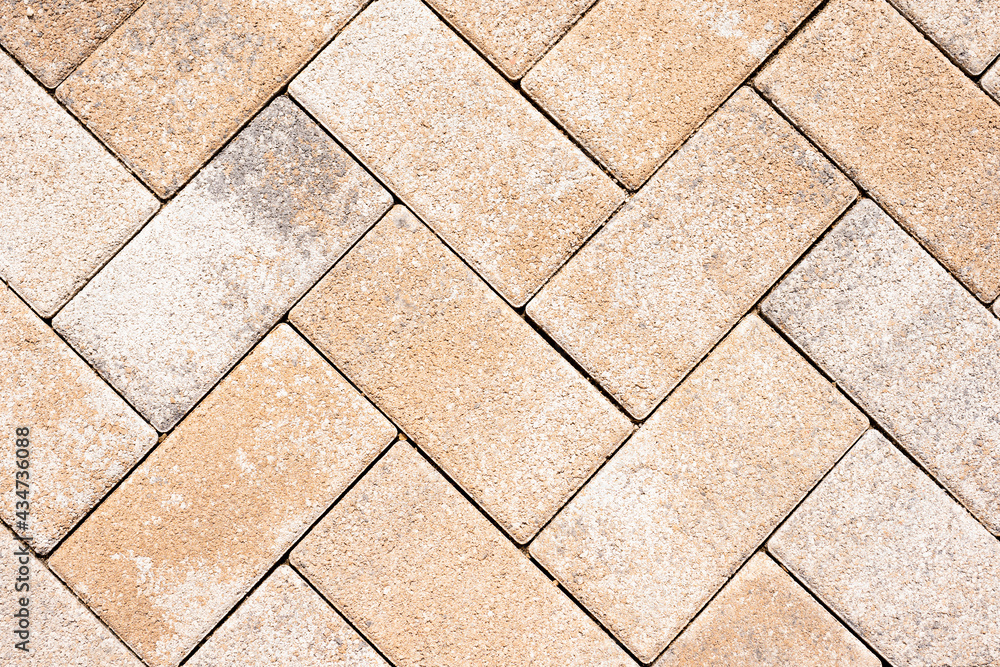 Fototapeta premium detail of tiles at the street gives a harmonic pattern