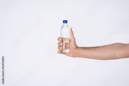 man holding a water bottle in his hand