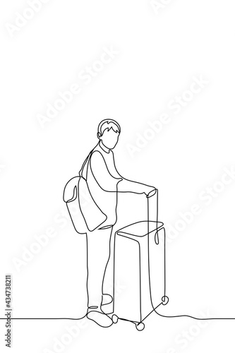 man is standing in a suitcase, on his back is a backpack and he is looking at the viewer - one line drawing vector. concept before train departure, before flight