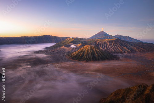 Mt.Semeru Mt.Bromo Mt.Batok , when the sunrise is lightly fog and the sky is beautiful. Smoke rising from the crater. , Indonesia Tengger Semeru national park. © Htomus