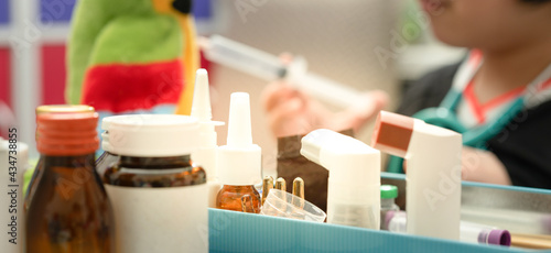 Variety of medicine package on tacle includes bottle spray MDI syrup on blur background photo