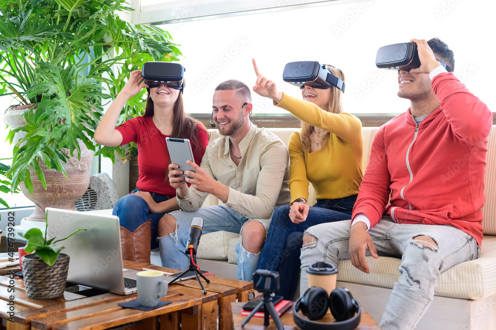 Young people employee workers having fun with vr wearing augmented reality headsets in startup office - High tech office professional people use virtual reality modeling software application Young people employee workers having fun with vr wearing augmented reality headsets in startup office - High tech office professional people use virtual reality modeling software application