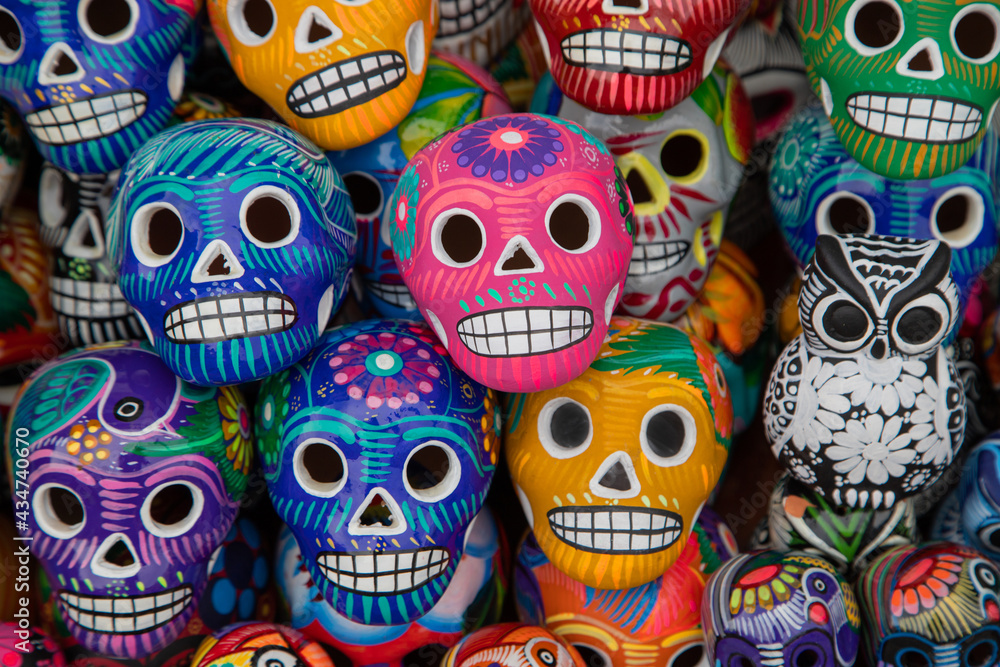Colorful traditional Mexican pottery in a street market. Mexican souvenir - skull