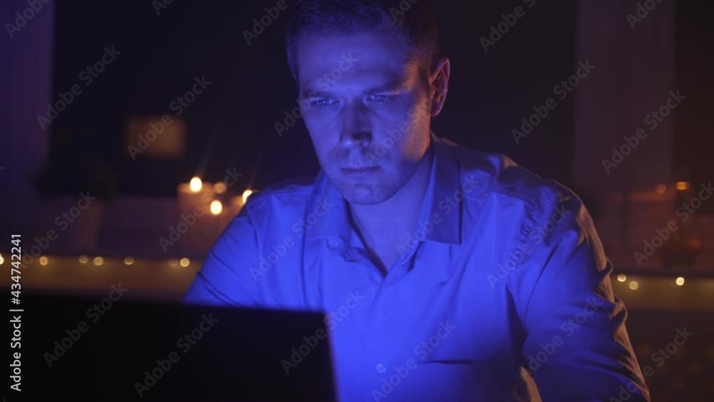 Man working on laptop pc at late night. Man working on laptop pc at late night.