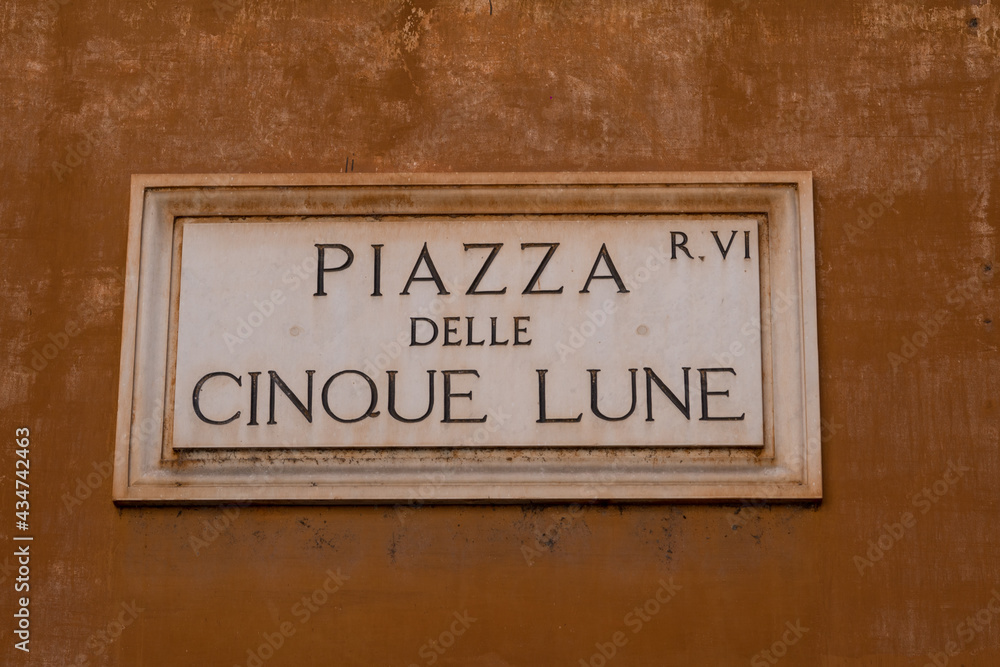 Street sign in the historical center in Rome, Italy, with the text: Street sign in the historical center in Rome, Italy, with the text: