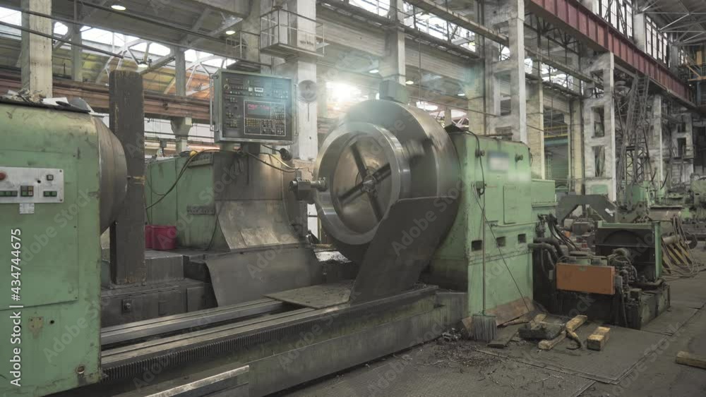 Lathe machine in factory, boring of part with milling tool. Metalworking machine grinds tube metal product. Lathe machine in factory, boring of part with milling tool. Metalworking machine grinds tube metal product.