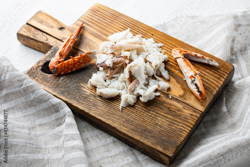 Boiled Blue swimmer crab meat or Horse Blue crab, Flower crab, on wooden cutting board, on white background photo