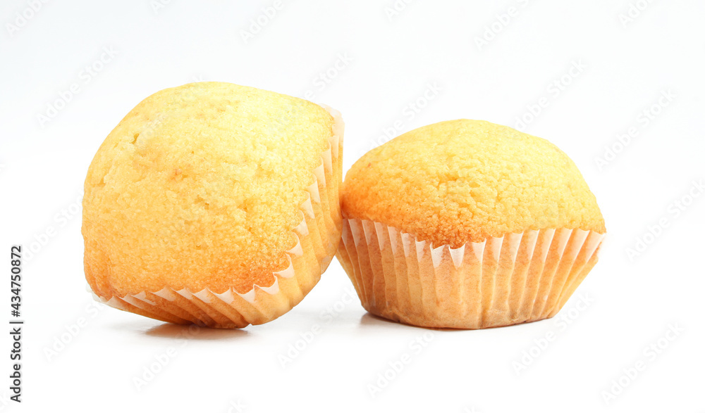 Two yellow muffin sweets isolated on white background