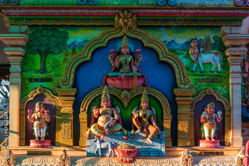 Colourful statues of Hindu religious deities adorning the interior of a Hindu temple in Singapore.