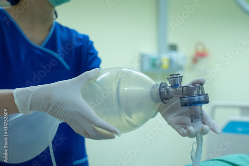 Slika na platnu Doctor hands holding resuscitation bag