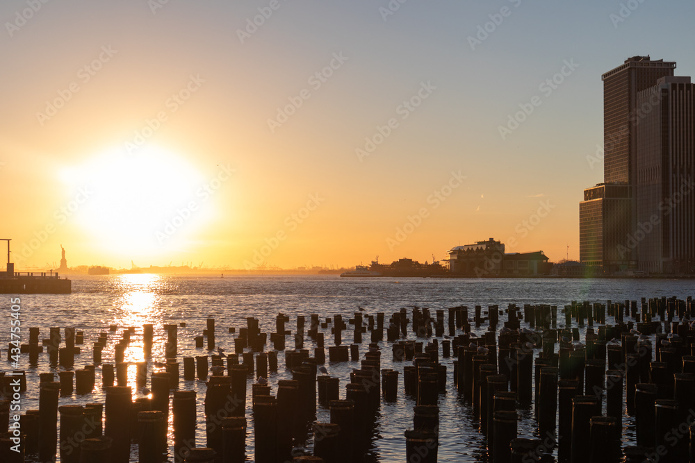 Beautiful New York City Sunset along the East River seen From the Shore of Brooklyn Heights