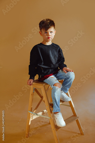 portrait of a fashionable little boy in the studio