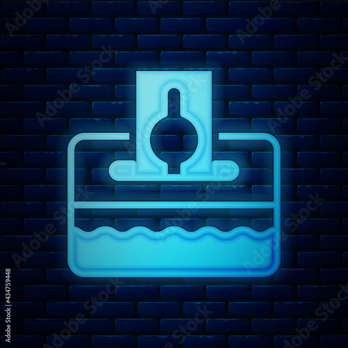Glowing neon Donate or pay your zakat as muslim obligatory icon isolated on brick wall background. Muslim charity or alms in ramadan kareem before eid al-fir. Vector
