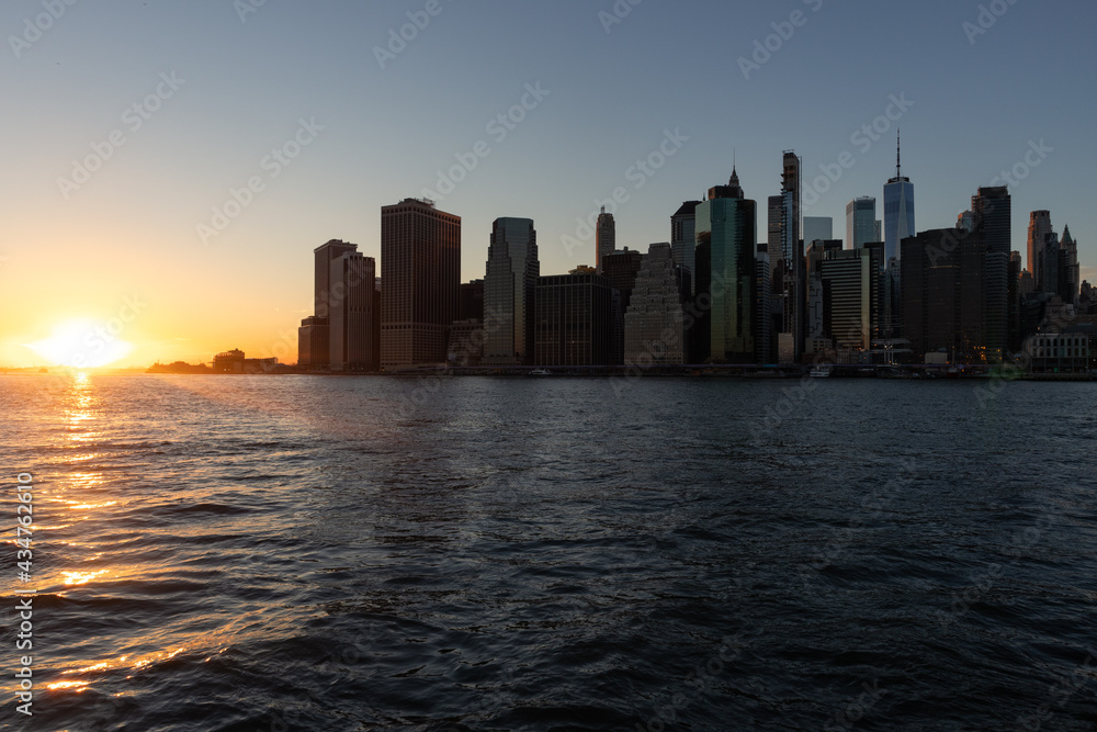 Beautiful New York City Sunset and Lower Manhattan Skyline along the East River