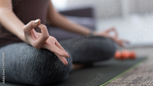 a lively girl doing meditate to keep calm mind and being relaxed as her indoor activity © snowing12