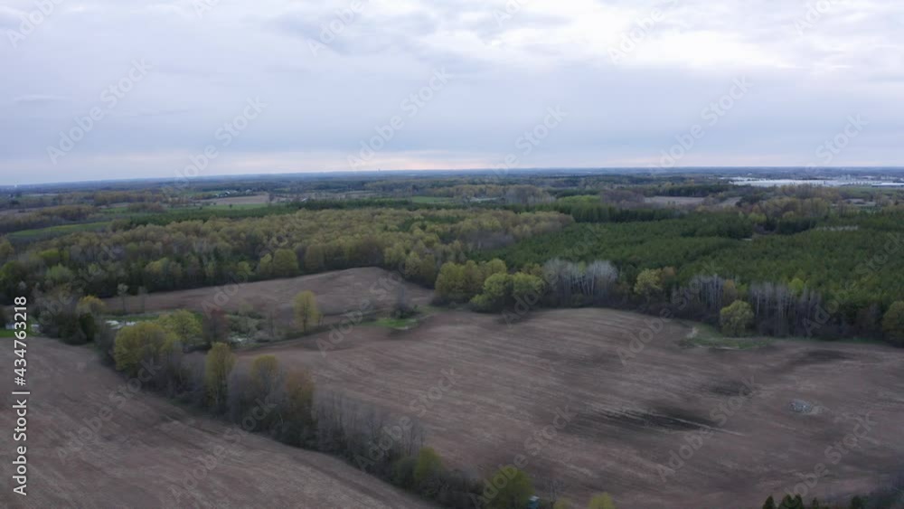A shot of a farmers field during a cloudy day. Farm is located at the south end of Guelph, Ontario in Puslinch. A shot of a farmers field during a cloudy day. Farm is located at the south end of Guelph, Ontario in Puslinch.
