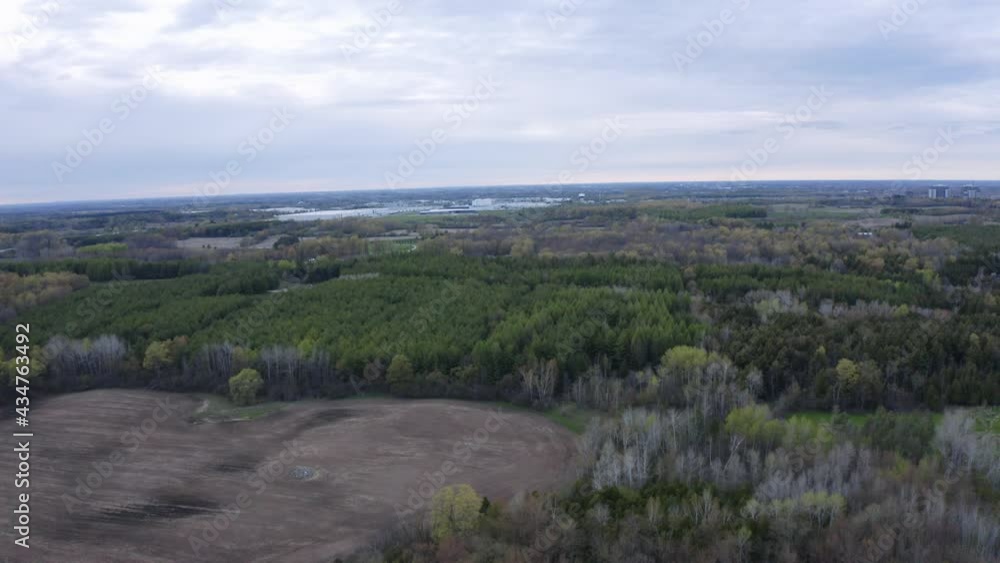 Shot of a farmers field that is located at the South end of Guelph, Ontario. Shot also includes a little bit of an estate home neighbourhood called Bridle Path. Shot of a farmers field that is located at the South end of Guelph, Ontario. Shot also includes a little bit of an estate home neighbourhood called Bridle Path.
