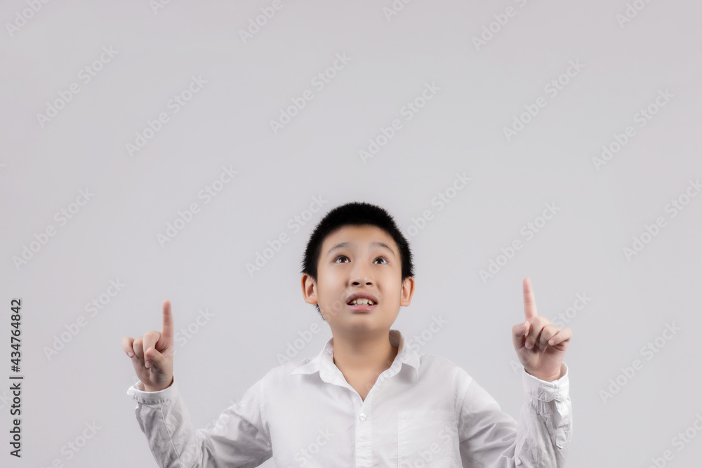 Asian boys studio portrait on gray background Asian boys studio portrait on gray background