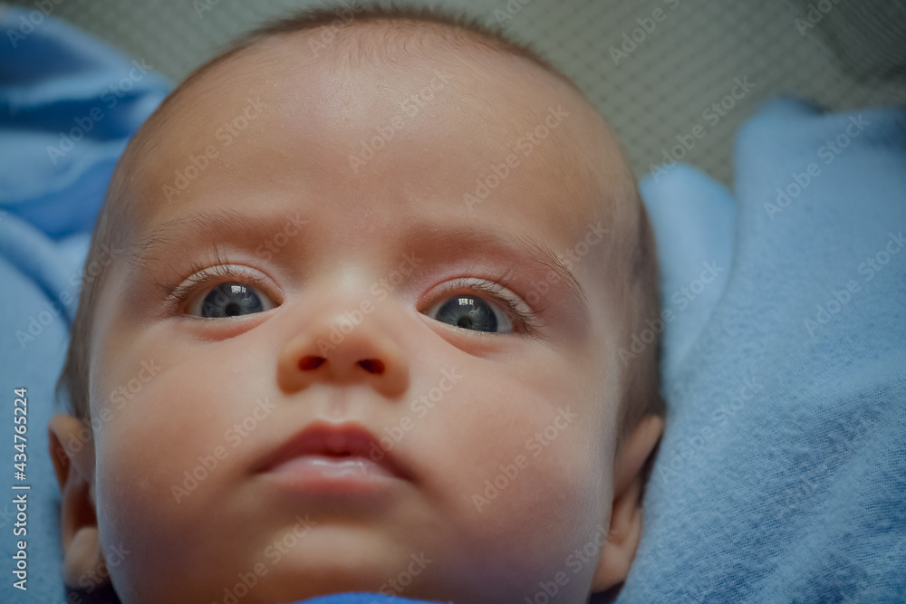 close portrait of baby expressing disbelief close portrait of baby expressing disbelief