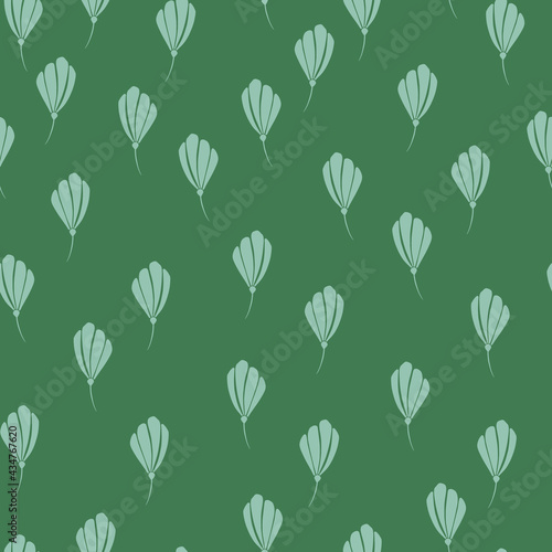 Decorative seamless pattern with little random flowers blue silhouettes shapes. Green background.