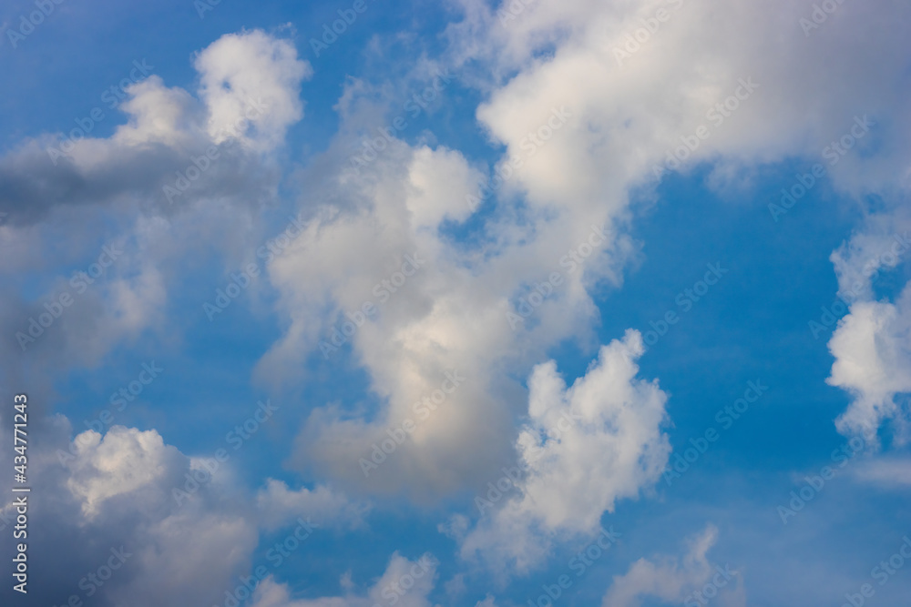White clouds moving under the sunny blue sky White clouds moving under the sunny blue sky