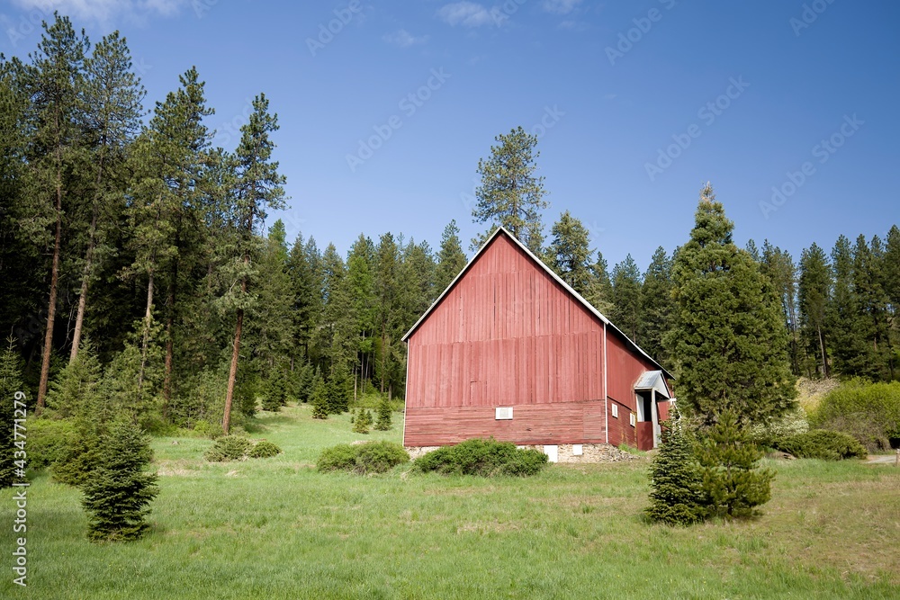 Red barn on a small hill side. Red barn on a small hill side.