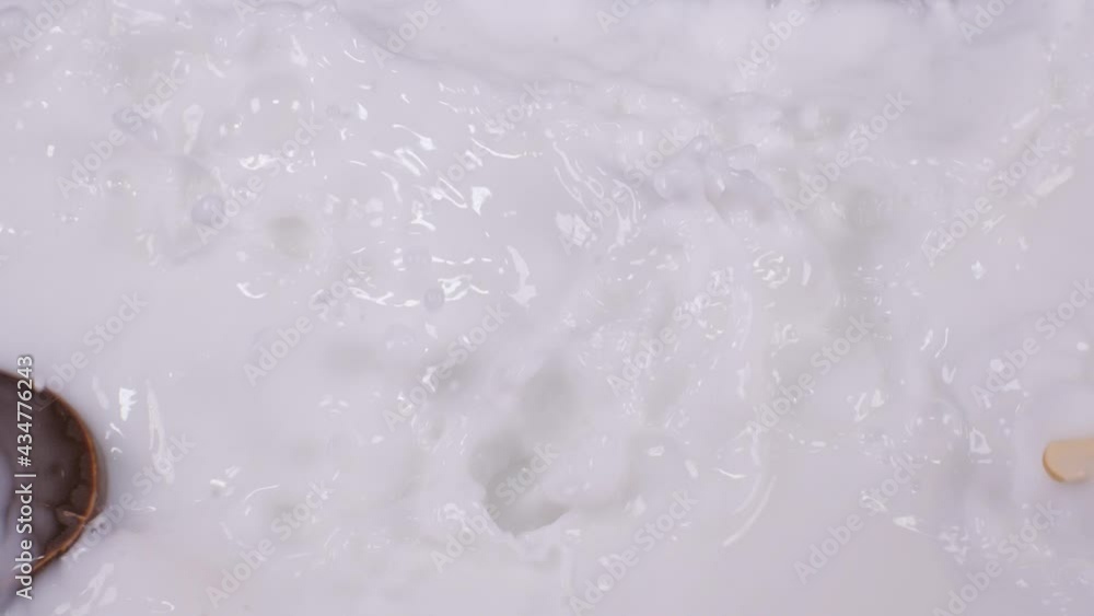 Popsicle ice cream falls into milk. Popsicle ice cream falls into milk.