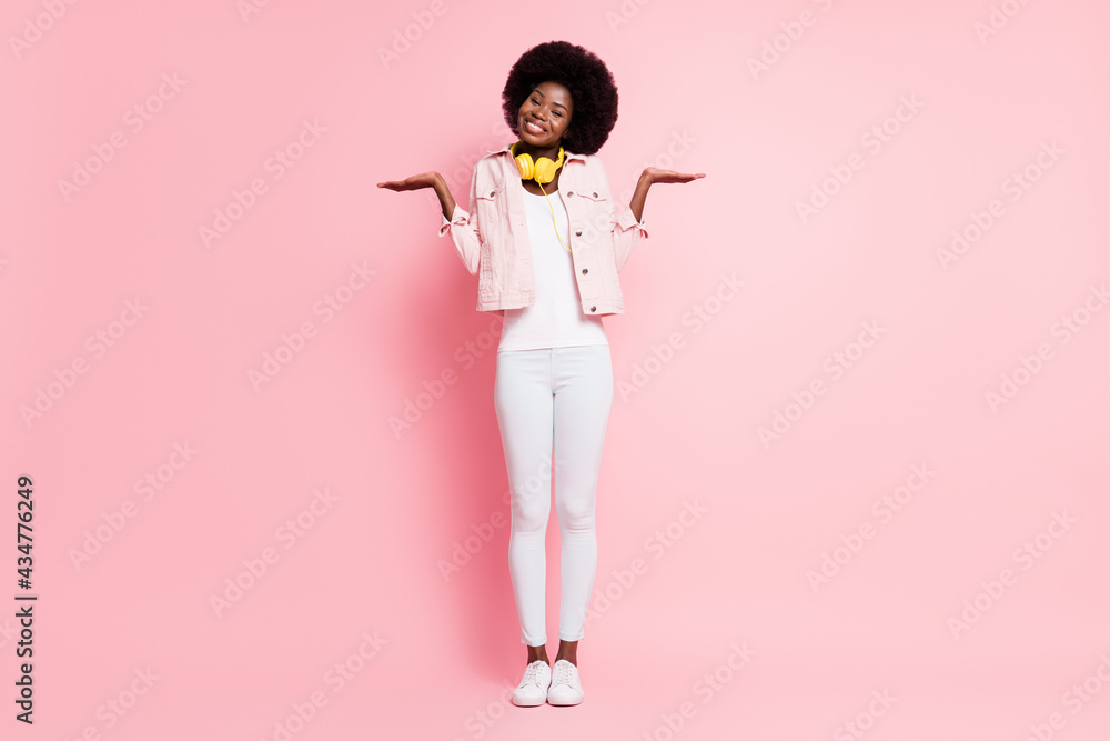 Full length body size view of lovely discontent cheery girl listening hit shrug shoulders dont know isolated over pink color background Full length body size view of lovely discontent cheery girl listening hit shrug shoulders dont know isolated over pink color background