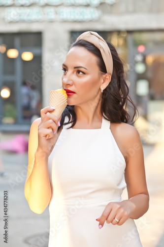 Happy Woman eating a delicious ice cream cone in vacation travel