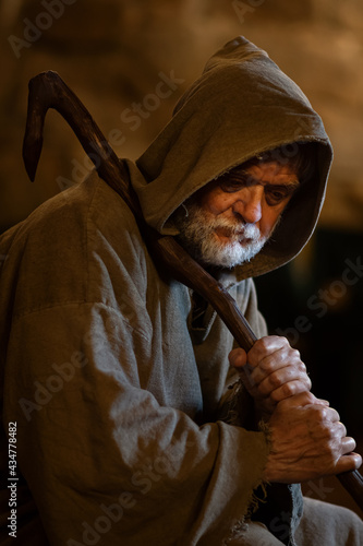 Old man tired and hopeless in the Middle Ages